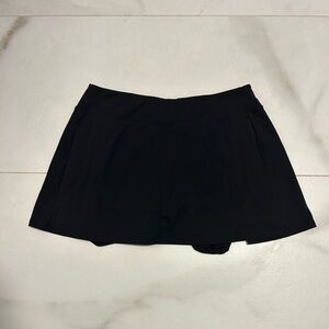 Black mini skirt with shorts under.
